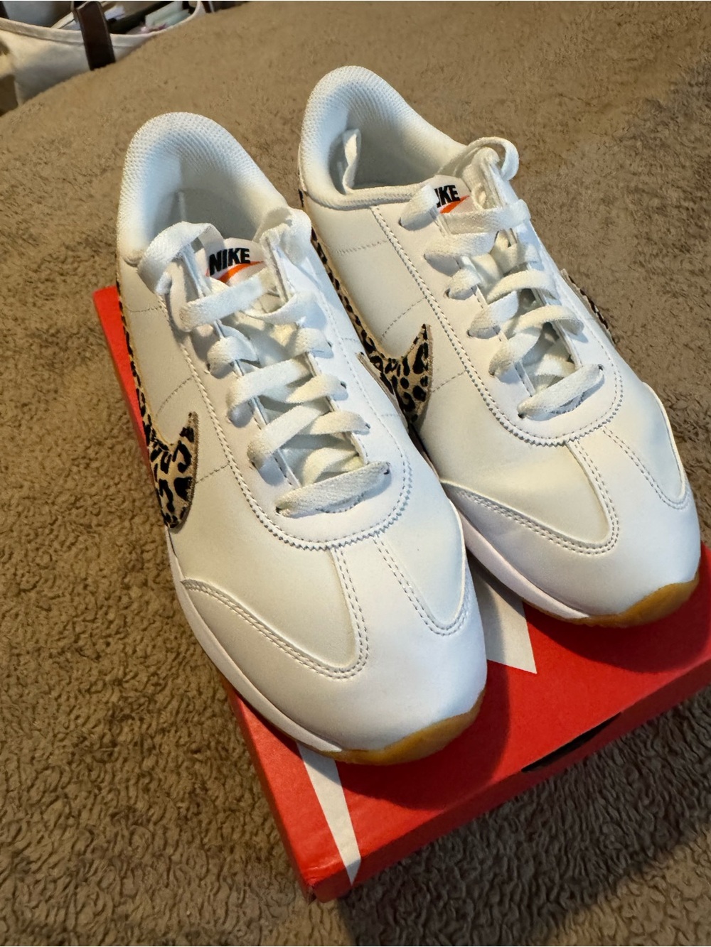 Nike Women’s White Sneakers with Leopard Print Swoosh